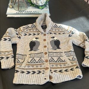 Penguins Aplenty Cardigan handcrafted by Lost Horizons. New from Sundance.